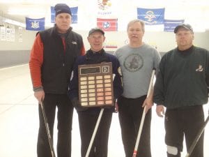 For the first time a team from Cook County has won the prestigious Minnesota Curling Association Senior Bonspiel. After surviving several rounds of tough games, the Pete Gresczyk team defeated a team from St. Paul to lay claim to the title and the traveling trophy. (L-R) Pete Gresczyk, Bob Spry (holding the plaque), Brian Smith and Marshall Pederson.