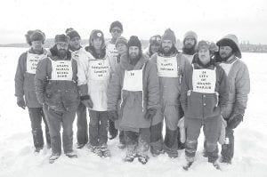 Not many of the original Gunflint Mail Run mushers were around for the 2012 version of the race. However, the son of one of them—Arleigh Jorgenson—was the winner of the 2012 Gunflint Mail Run. Odin Jorgenson is carrying on the family tradition of dog sled racing and he was the first across the finish line on Tuesday, January 31. He certainly was cheered on by his dad and these old-timers. Pictured here in the late 1970s (L-R, front) Peter Redmond, Phil Fleming, Jim Cowper, John Patten, Ted Young. (L-R, back) Arleigh Jorgenson, Tim White, David Fromm, unknown, Paul Fleming, Kevin Turnbough, Jim Stevens.