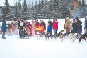 The start of the Gunflint Mail Run was exciting, but friendly. The crowd—including his wife, Betsy and sister, Anna—cheers as Odin Jorgenson takes off at dusk in the Gunflint Mail Run on Monday, January 30.