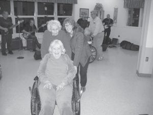 The North Shore Care Center happily welcomed back the band Portage on January 28. They took a break over the holidays, but are now back to perform at the Care Center on the last Saturday of each month. Upper left: Sisters Donna Willett and Irma Toftey danced together along with Shelly Norman. Upper right: Marge Jamison and Jenny Dell strolled on the dance floor and gave a thumbs up to the band Portage. Marge stated, “The band Portage brings out the best in everyone.” Above left: There are always lots of dancers on the floor thanks to families, friends, and community volunteers! Above right: Everyone enjoyed the classic country music and enjoyed watching the dancing.