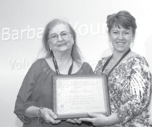 Barbara Young, of Poplar Creek Bed & Breakfast in Grand Marais, received the 2011 Minnesota Bed & Breakfast Associations’ Volunteer of the Year award. B&B Association President Shannon McKeeth presents the award to Barbara (left) at the 2012 Explore Minnesota Tourism Convention in Rochester, Minn. on Jan. 25.