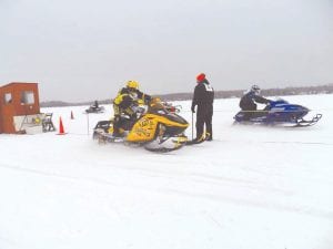 A need for speed! The Cook County Ridge Riders held the first snowmobile drag races of the year on Devil Track Lake on Saturday, January 21. The snowmobile drags give snowmobilers the chance to see what their machine can do. Taking off from the line—Tony Everson, on the left.