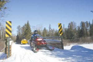 Snow! The organizers of the Grand Portage Snowarama for Easter Seals Kids were wishing for snow and they got it. Hundreds of snowmobilers enjoyed Cook County trails, riding a short route from Grand Portage Lodge to Ryden’s Border Store or a 50-mile trek to Devil Track Landing. Along the way they encountered other riders taking part in the Cook County Ridge Riders Snowmobile Club Fun Run too. It was a great day on the trails.