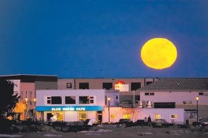 The calendar says that the moon was full on Tuesday, February 7, but it has been shining brightly for several days now. David Johnson didn’t just admire the luminescent orb, he got out his camera and got this nice photo of the moon hovering over downtown Grand Marais.