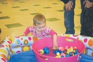 There were fun games for all ages at the Girl Scout Carnival, including a duck pond. Little ones preferred splashing in the water over selecting a prize-winning duck.