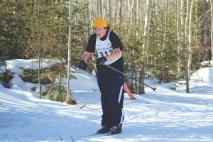 With the temperature near 40 degrees, Dylan Deschampe skied the Pincushion races in a short-sleeved shirt.