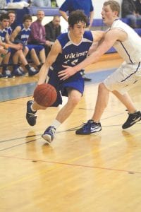 One of the key reasons the Viking boys basketball team is 16-1 this year is because of the heads up play by senior guard Mike Sjogren. Here Sjogren blows by a defender for a lay-up.