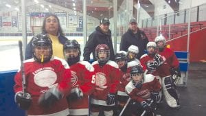 The Cook County Hockey Association’s youngest team, the M-2s, has been practicing regularly and participating in numerous tournaments outside the county. Pictured here are (L-R) Pat Pierre, Jr., John Pierre, Kevin Viren, Ryan Christiansen, Johnny VanderHeiden, Danny Deschampe (in front), Nate Bilben, and Ryan Bilben. Team coaches, in back, are (L-R) Tom Jack, Pat Pierre, and Andrew Bilben.