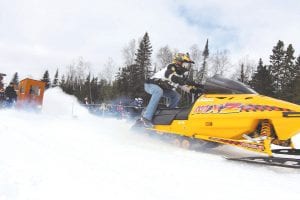 The weather was wonderful at the Hungry Jack snowmobile drag races. It was warm enough for Greg Gresczyk to race in jeans and sneakers! Gresczyk finished well, taking second in the Open Class division.