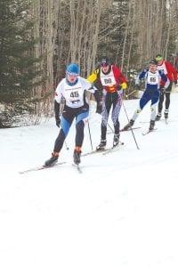 Although members of the North Superior Ski & Run Club had to do a little extra work to make sure the trails were good, the 29th annual Sawtooth International Ski Races went off without a hitch on Saturday, February 18. Many volunteers spent time shoveling snow onto the race course throughout the week leading up to the races—much to the delight of both racers and spectators. The Sawtooth races provided opportunities for both classic and freestyle skiers to test their abilities on the Pincushion Mountain trails. Above, in 3rd place on the first loop of the 19.5 K freestyle race, (wearing bib No. 65) Matt Zak glides along biding his time. He would go on to win the race by 3 minutes over Rhett Bonner of Duluth, who is wearing bib No. 80 and is just ahead of him in this picture. Scott Cody, wearing bib No. 45, would go on to finish 10th overall. See race results on page B2.