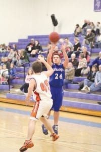 Above left: Known most for his defense and rebounding, Justin Goldstein doesn’t shoot often, but when he does shoot it’s usually good. Above right: Jordan Lack uses his quickness to make a move past the Wrenshall guard.