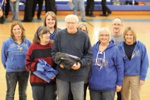 Fans of the Year! Longtime Cook County High School sports fans Ken and Molly Hoffman were honored by the CCHS booster club as the Viking “Fans of the Year” during the intermission between the boys' and girls' games against the Wrenshall Wrens. They each received Viking sweatshirts from the Cook County Booster Club.The other Viking boosters pictured here with Ken and Molly are (L-R) Cindy Crawford, Julie Puch, peeking over Ken’s shoulder is Virginia Palmer, Helena Blake and Chris and Terri Goettl.