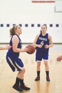 Far left: Senior forward Bekah Laky scored 15 points against the Two Harbors Agates. Her play helped the Vikings even the score against the Agates, who beat the Vikings earlier in the season. Above: Deedra Mongan looks for an open Viking player to pass the ball to. Left: Jordan Deschampe, like Mongan, is a young player who has been seeing more varsity playing time as the season has progressed.