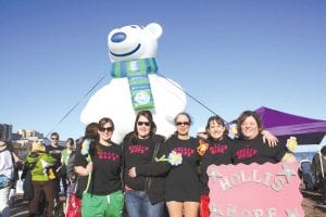 Four brave women participated in the Polar Bear Plunge in Duluth on February 18, raising funds for Special Olympics Minnesota. (L-R) Jessica Jacobsen, Brianna Houglum (lending moral support), Lollie Cooper, Bryann Bockovich and Linda McClellan. They took the plunge to benefit Special Olympics and to honor Linda’s daughter, Holli. Their team was “Holli’s Hope.”