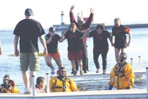 Are we really doing this? The women bravely took the plunge. Participants hit the water and then had to run to shore—where they had to wait in line to warm up! They were frozen but had fun and will likely do it again in 2013.