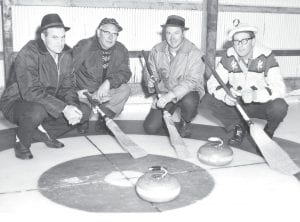 After Grand Marais Lions Club members tried curling at a bonspiel in Thunder Bay (at that time Fort Francis and Port Arthur), they decided to bring the sport to Cook County. Some of those original curlers are pictured here at a bonspiel in Grand Marais in the 1960s. (L-R) Dave Erholtz, Ade Toftey, first Curling Club Treasurer Sid Backlund, and first Curling Club President Chuck Futterer.