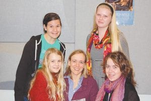 Some of the cast members of the upcoming Grand Marais Playhouse production Little Women took a break during rehearsals for a photo. (L-R, front) Linnea Henrikson (Amy), Amy Henrikson (Marmee), Mara McDonell (Jo). (L-R, back) Sarah Larsen (Beth), Cailan Carpenter (Meg).