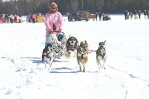 Adam Treeful of Grand Marais takes off from Gunflint Lake in the 2012 Mush for a Cure on Saturday, March 10. Treeful was crowned the 