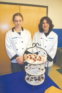 Meadow Adams and Shawn Neuwirth demonstrated both culinary and hospitality skills as they served up delectable desserts from the CCHS culinary arts department at the annual Enriching Academics through Sustenance (E.A.T.S.) fundraiser on March 8.