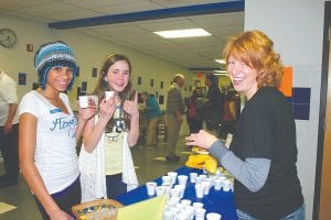 (L-R) Molly Thomas and Santina McMillan enjoyed tasty and healthy Herbalife shakes served by Beth Foster of Grand Marais Fusion.