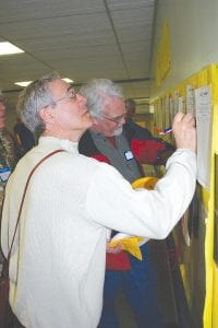 Lots of bidding went on at the silent auction that helped raise funds along with ticket sales.