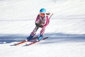 Team Lutsen took over Koo- Koo in Race No. 5 of the Northland Junior Race Series at the end of January. Top: Reilly Wahlers sets the pace in girls 10-11 and claims first place. Above left: Anna Heeren pushes herself toward the finish. Above: Jack Viren puts up a solid performance against a very competitive field at the Lutsen meet. Left: Teammates Halle Lamb, Sela Backstrom, Elsa Lunde and Bianca Zimmer were all smiles despite the cold, windy day.