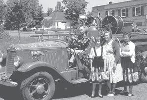 Ray Duane Ruggles of Georgia, a frequent North Shore visitor, sent this photo to the Cook County Historical Society. He was recently going through some slides of his visits and came across this photo of a group of people next to a Grand Marais Fire Truck. They are standing on 2nd Street. Behind them is what was then Matt Johnson’s grocery store. The historical society would love to know who these people are. Please let us know if you recognize them and know why they are posing with a fire truck.