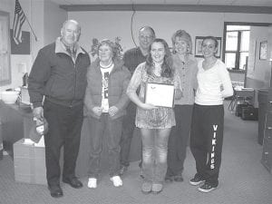 MaeAnna LaFavor was recognized for her many volunteer activities on Wednesday, March 7. Principal Gwen Carman was happy to present her with the President’s Volunteer Service Award. The award—and her family’s presence at the presentation—were a surprise for the busy 8th-grader. (L-R) MaeAnna’s grandparents Dannie and Barb Jones, her dad Jay LaFavor, MaeAnna, her mom Laura LaFavor and her AFS sister from Paraguay, Alexia Simon.