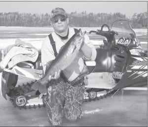 A great day on Northern Light Lake! Left: Tails from the Trail columnist Cory Christianson with the 28-inch walleye he caught on what was likely the last day for ice fishing. Above: Fishing with Cory was Dave Schudy, who caught an impressive 29-inch walleye. They also caught a fair amount of whitefish and trout.