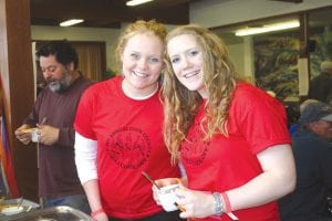 Chili contest T-shirt models! In addition to showing off the colorful chili contest T-shirts, Sarah Fagerman and Bekah Laky collected money and made sure that diners filled out cards to nominate the “People’s Choice” chili at the Saturday, March 24 chili feed.