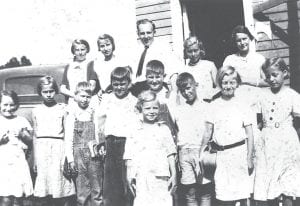 The young people pictured in this Historical Reflections photo were attending Bible School at Good Harbor Hill Town Hall. Thanks to Janet Schuster Nagy who sent this fun photo that was taken in 1933 or 1934. The students are: Front: Dorothy Nicolaison. (L-R, middle) Harriet Olson, Ethel Nicolaison, Carl Nicolaison, Glenn Helmerson, Roger Olson, Harry Olson, Thelma Rude, Lorraine Jones. (L-R, back) Gudrun Blomberg, Catherine Nicolaison, Pastor George Gustafson, Ruth Blomberg, Doris Helmerson.