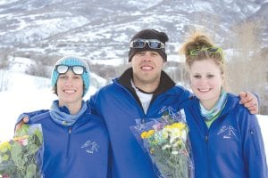 Trevor Edlund, Ski Coach Brian Nelson and Elizabeth Wallace celebrate a victory on the slopes. Elizabeth won the individual jumping title for J2 Girls (14-15 year olds) at the U.S. Junior National Championships for ski jumping in Park City, Utah during the first week of March.