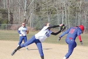 Top: With eighth-grader Madison Roy looking on from second base, Katie VanderHeiden makes a great catch at first. The Rebel runner was out. Above: With the bases loaded Anna Carman gets ready to blast a triple in the 6th inning. Right: Sarissa Falk gets ready to deliver a pitch. Falk pitched a great game and held the 3A school in check most of the contest.