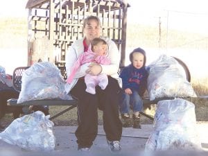 Why wait until Earth Day to clean up our community? Molly LaFreniere and her son, Matthew, 2, spent some time on April 5 cleaning up the Cook County Community Center park area. Molly said, “We collected four huge bags of garbage and now the park is officially clean! I hope it stays that way all summer.” With Molly and Matthew is baby Cadience, just 9 months old.