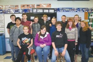 Revolution, Reaction and Reform was the topic that the History Day presenters had to demonstrate. (L-R, seated) Matea Acero, Trace McQuatters, Will Seaton. (L-R, back) Roman Schnobrich, Ian Nelson, Sean MacDonell, Jaret Baker, Owen Anderson, Leo Johnson, Frankie Miller, Sarah Carman, Lily Gruber-Schulz, Madison Roy. (Not pictured: Rory Bakke, MaeAnna LaFavor.)