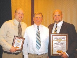 Quite a few years of Cook County High School Viking football history were represented at the 48th annual Minnesota Football Coaches Association banquet held recently in Minneapolis. Current Head Coach Mitch Dorr (left) received Coach of the Year for the Red Division of the Polar League and long-time Mike Boomer (right) received the Butch Nash Award for his many years as an assistant coach. Between them is former Head Coach Lyle Anderson. Anderson was inducted into the Minnesota High School Coaches Hall of Fame in 2003.