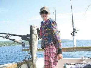 Captain Kelly Shepard is offering families who don’t have a Lake Superior boat the opportunity to get out on the Big Lake on May 5 – 6. He wants to see more smiles like this young lady’s.