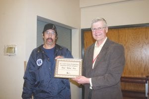 Willie Olin of the Colvill Fire Department, captain of Cook County Search and Rescue, was presented with the 2011 Emergency Services Provider Award in recognition of his leadership in search and rescue. Emergency Management Director Jim Wiinanen made the presentation at the Emergency Management Conference Saturday night dinner.