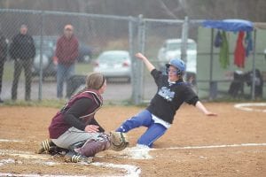 Running like “Speedy Gonzales” Signe Larson slides beautifully beneath the tag of the Barnum catcher to score a run for the Vikings.