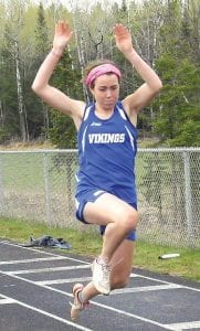 The Cook County Track team’s first two competitions were in Two Harbors. The Vikings performed well against powerhouse track teams Esko, Two Harbors, Eveleth and Moose Lake. Left: Mara MacDonell gets ready to take flight over the long jump pit at the Two Harbors track meet. In addition to long jumping, Mara also runs a variety of events on the track. Above left: Kyle Martinson sprinted for all he was worth down the runway on his way to long jumping 15 feet 6 inches at the Two Harbors meet. Above right: Melanie Stoddard shows fine form as she gets ready to triple jump at the meet in Two Harbors. Mel jumped 21 feet to place 8th overall.