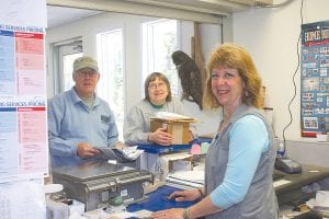 Hovland Postmaster Sandy Updyke’s last day will be June 1, 2012. She has enjoyed greeting the Hovland public since 1971. Hovland postal customers Rich and Jan stop to get their mail—and to chat about tomatoes and the tick population.