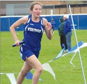 Above: Audrey Summers ran a strong last leg in the 4x800-meter relay event at Conference. The Vikings finished 6th with a time of 11:34. Right: Nate Carlson ran a blazing 2:13 relay leg for the Vikings in the Conference 4x800 relay and led the Vikings to a 3rd place finish.