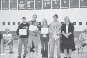 Above: Among the honorees were four students who received full tuition to Lake Superior College for one year. (L-R) Bradley VanDoren, Jordan Lack, Michaela Buchheit and Gunnar Anderson. Presenting the scholarships was Joan Gardner-Goodno of the Lloyd K. Johnson Foundation, on the right. Left: Receiving the Scott Scholarship were Salutatorian Cecelia Olsen and Valedictorian Ashley Ross. The happy presenter was Principal Gwen Carman.