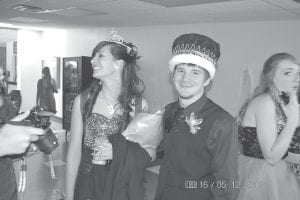 Left: Prom Queen Ashley Ross and King Bradley VanDoren accept congratulations from friends and family after coronation.