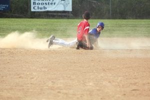 Thomas Anderson throws up a cloud of dust as he aborted an attempt to steal and dove back to second base. He was safe in the game against Mesabi East.