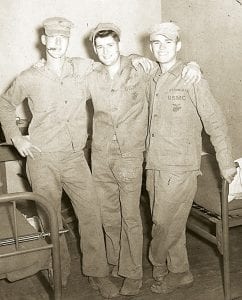 Above left: Pat Finn, of Grand Marais and Minneapolis, was just 18 years old when he was deployed to Korea. The young Marine ended up in one of our nation’s worst battles, the Chosin Reservoir Campaign. Above: Corporal Finn (center) is pictured here with his buddies, Ken “Wee Willie”Wilson of St. Louis, Missouri and Hugh Feibig, of Seattle, Washington, in Hawaii as they recovered from the injuries they received during the siege.