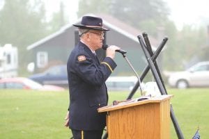 Above: Post 413 Commander Don Wilson read the names of the members of the Armed Forces with Cook County ties who have died over the last year. Each name was marked with the ringing of a bell. Right: Liz Hall of Grand Marais sang the National Anthem beautifully.