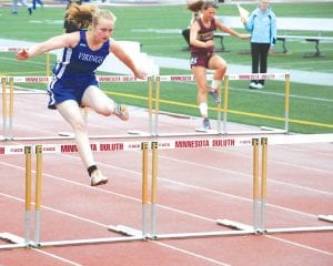 Three Vikings will advance to Section 7 finals—Molly Zafft, Peter Warren and Jessica Berg-Collman. However, nearly all of the Viking track team members achieved personal bests at the Sub-Section 7 track finals at UMD on May 23. Above: The Cook County Viking developing hurdling crew was led by junior Meadow Adams who finished 8th in the 300 meter low hurdles in 54.43, missing the 7th place qualifying time by 3/10s of a second. Right: Seventh-grader sprinter Molly Thomas led the Viking girls in the 400 at 71.3.