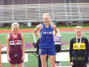 A very happy senior Molly Zafft on the podium. Molly led the Vikings at the South Sub-section track meet at UMD, winning the 100-meter dash in a PB (personal best) of 13.21, and finishing 2nd in the 200 in 27.37.