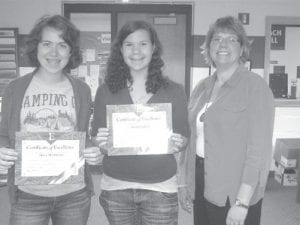 Cook County High School Principal Gwen Carman is proud to present certificates of excellence to CCHS juniors Mara MacDonnell and Sarah Larsen. Mara and Sara both scored in the top 3% of all students in the nation taking the preliminary scholastic assessment test (PSAT).